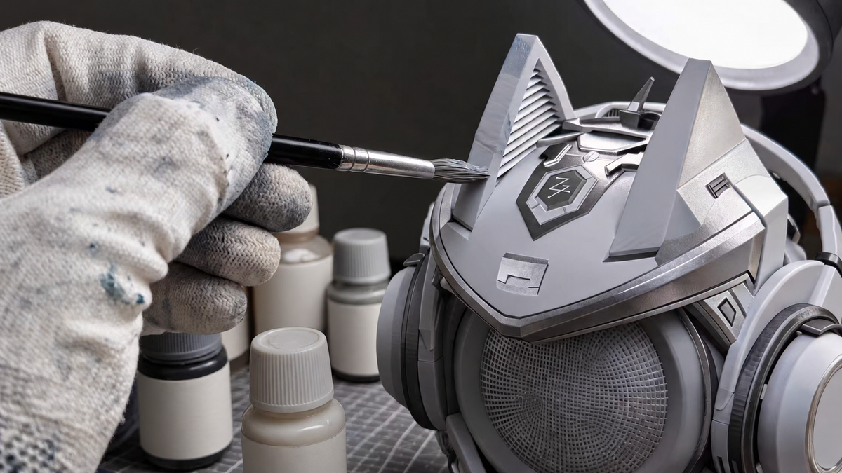 Hand painting the silver OLLIE figure