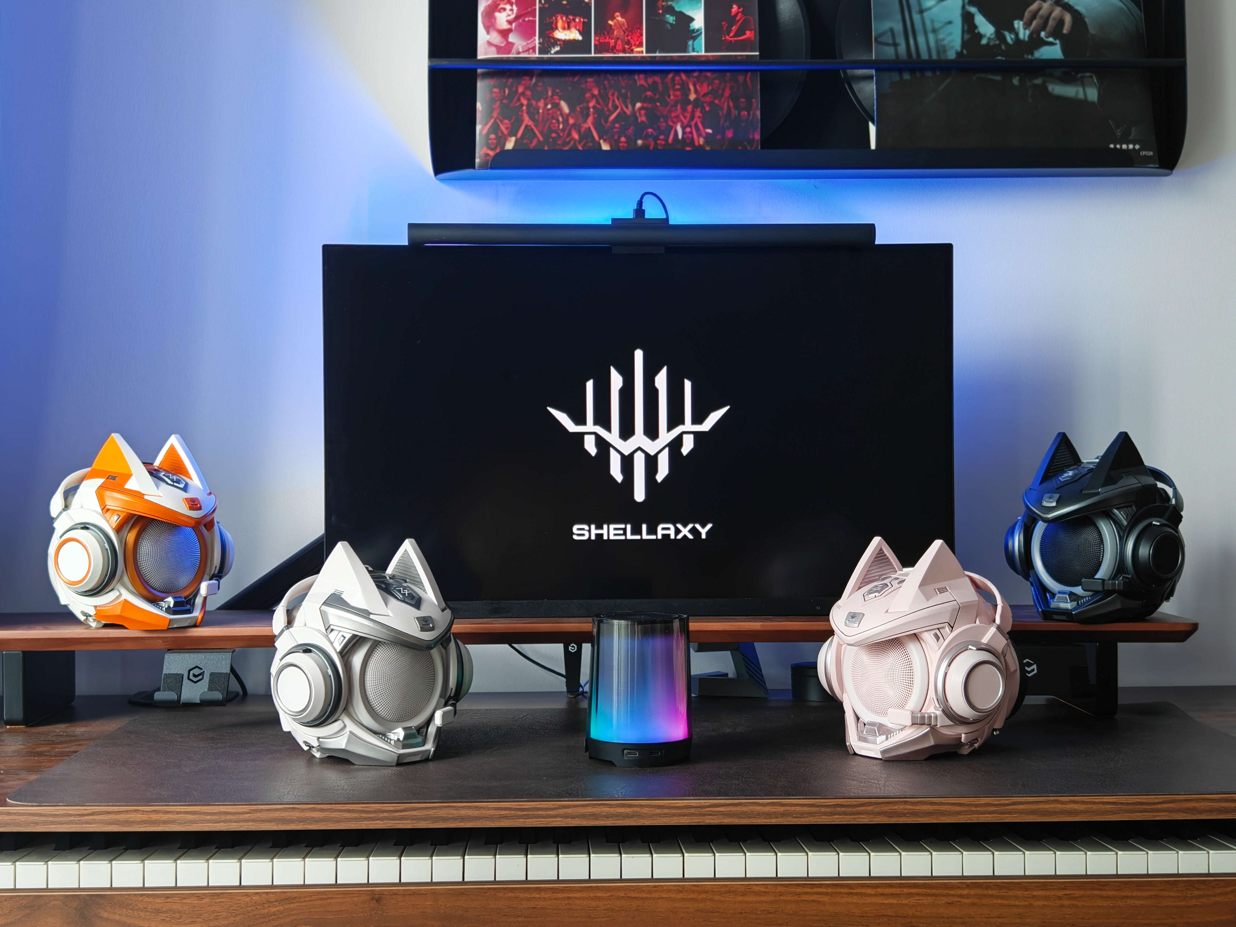 Four OLLIE collectible speakers in a desktop setup