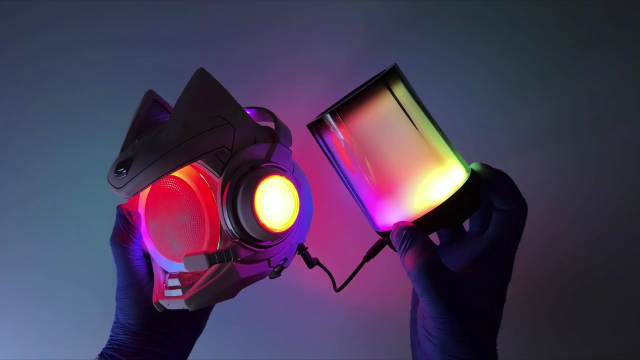 Dr. Tech holding OLLIE and its detached illuminated speaker
